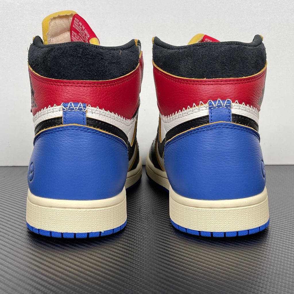 Pair of high-top sneakers from heel, blue leather with black backs and red ankle panels