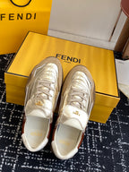 Fendi low-top sneakers: metallic silver uppers, brown heel panel, lace-up.