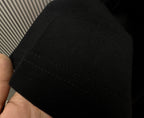 Black T-shirt fabric and hem stitching detail