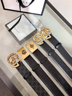 Gucci belt with black leather strap and gold interlocking G buckle