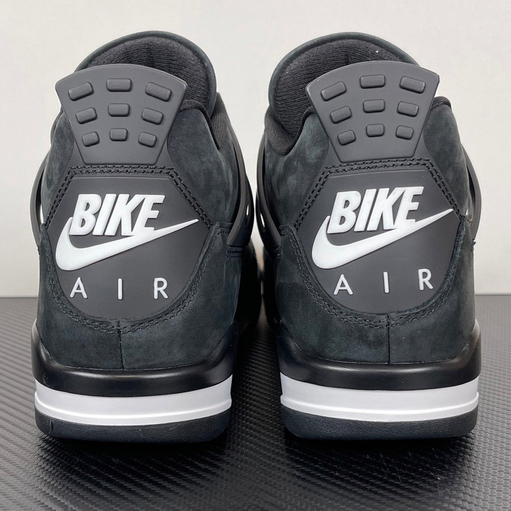 Air Jordan 4 sneakers, dark gray heel with "BIKE" logo and "AIR" lettering