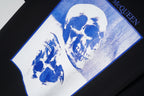 Alexander McQueen T-shirt: black with large blue skull graphic on white print