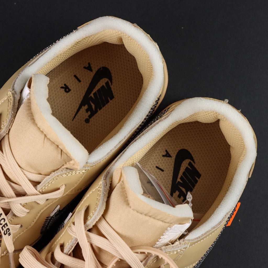 Close-up of cream sneaker insoles with NIKE branding and cushioned collar