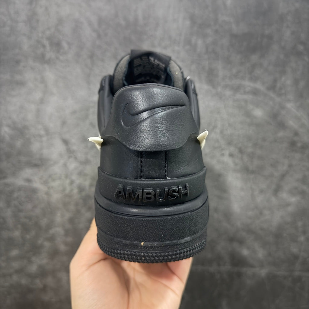 Black sneaker heel with AMBUSH text and Nike logo on the back tab