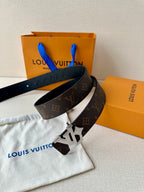 Louis Vuitton monogram belt with dark strap and silver-tone LV buckle, angled