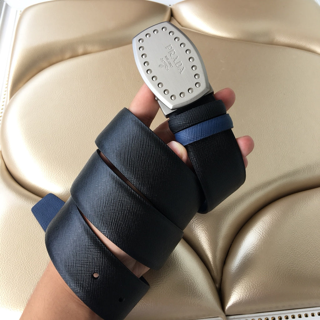 Navy fabric belt with silver studded Prada buckle and blue accent strap end