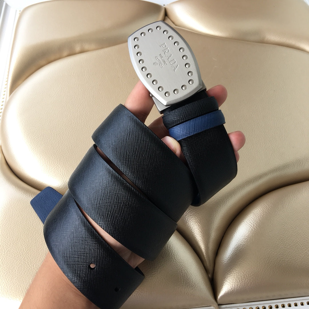 Navy fabric belt with silver studded Prada buckle and blue accent strap end