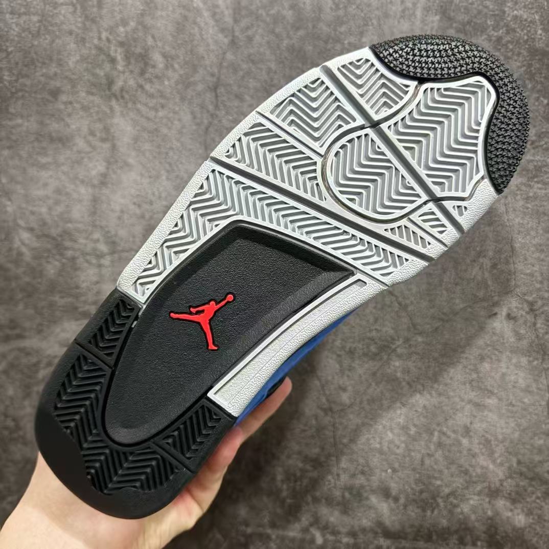 Air Jordan 4 sneaker outsole with black-and-white tread pattern and red Jumpman logo
