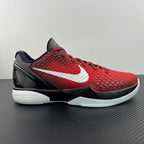 Red basketball shoe with white swoosh, black accents, and black midsole.