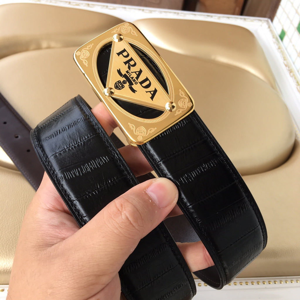 Black leather belt with textured strap and gold Prada logo buckle