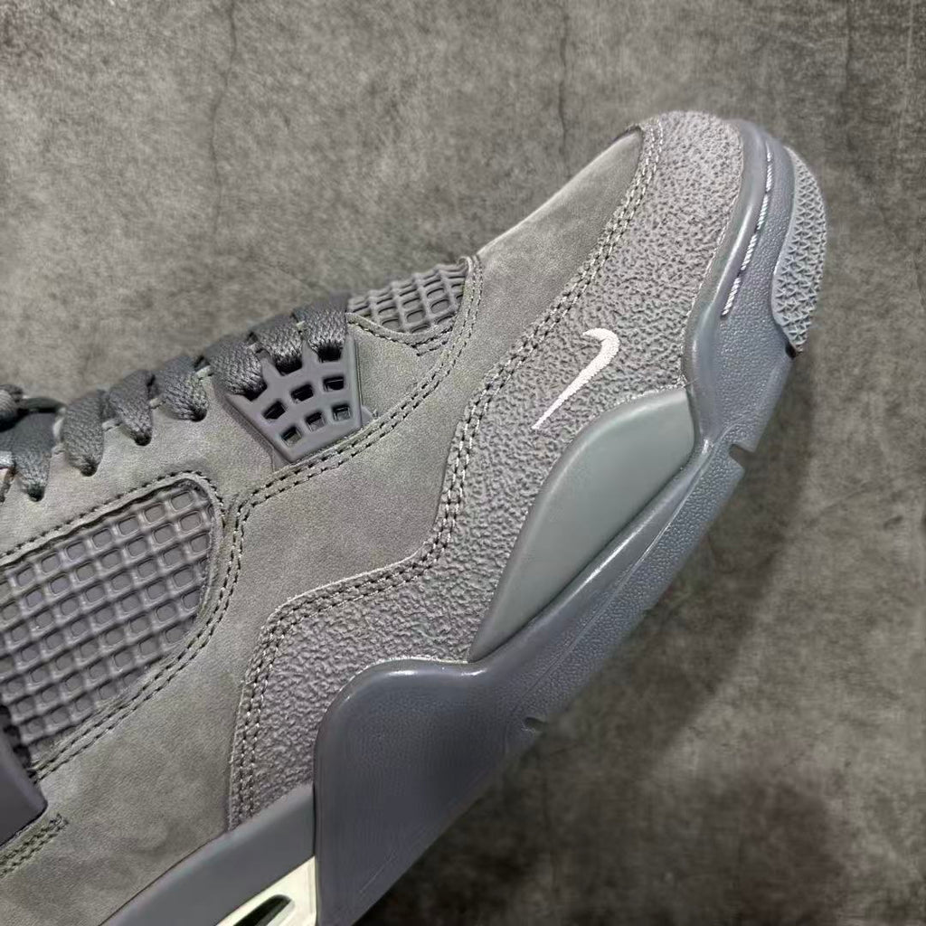 Gray suede sneaker profile with Swoosh mark and translucent side wing detail