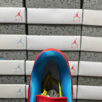 Red sneaker interior with blue collar and visible lining.
