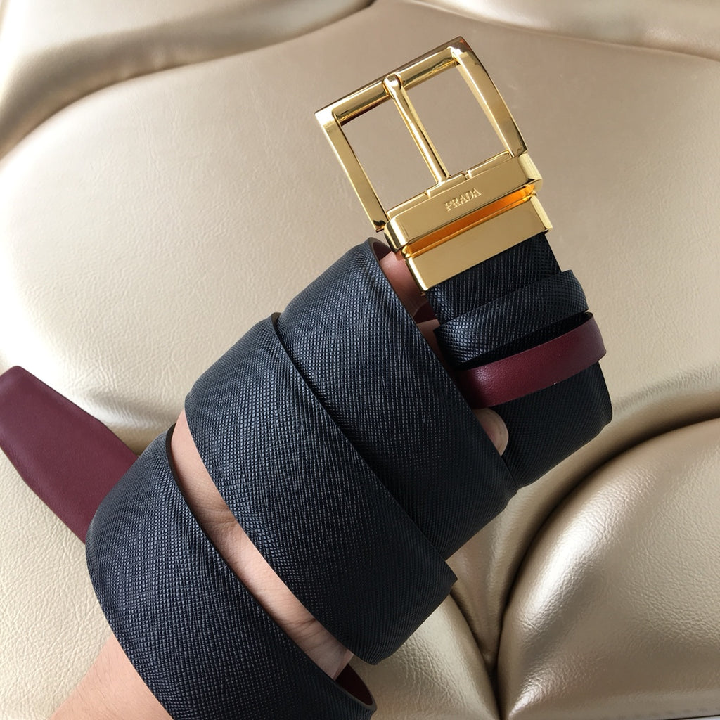 Prada belt buckle and end, gold frame on dark strap with burgundy underside
