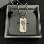 Silver-tone bead dog tag necklace displayed in box with pendant