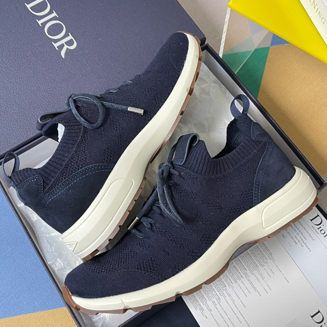 Navy unisex sock-style sneakers with lace-up closure and white midsole