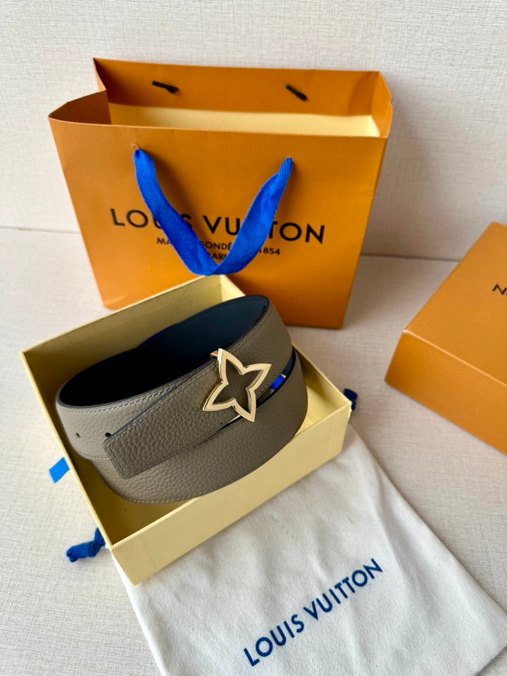 Louis Vuitton belt with light gray strap and star buckle, with dark blue lining