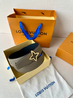 Louis Vuitton belt with light gray strap and star buckle, with dark blue lining