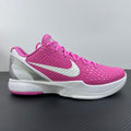 Pink and white low-top basketball sneaker with white swoosh and padded collar