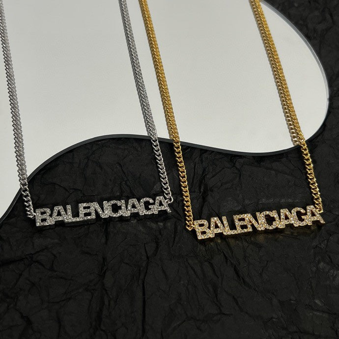 Silver and gold Balenciaga logo pendant necklaces with chain