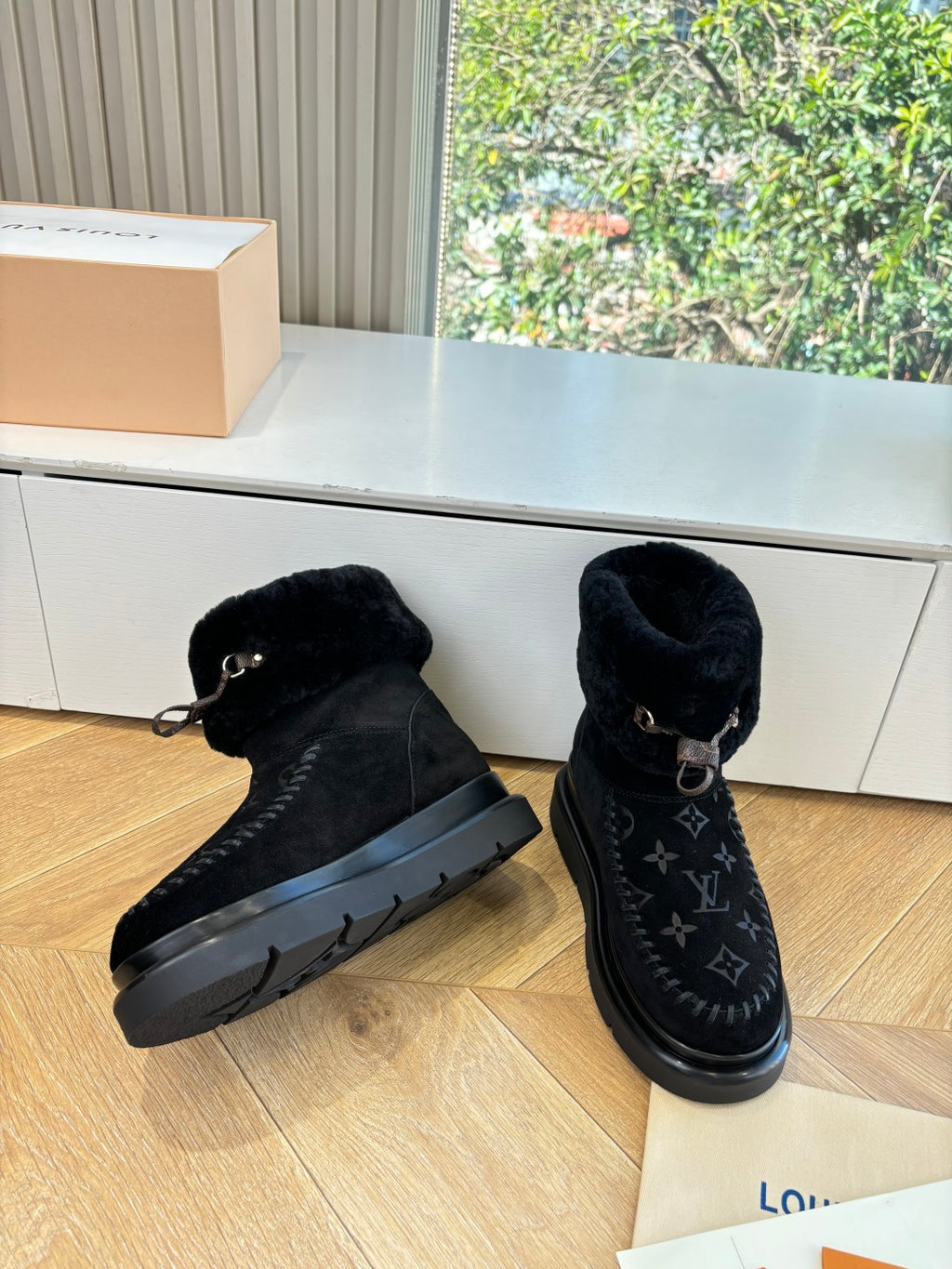 Black Louis Vuitton unisex ankle boots with monogram panel and rubber tread sole