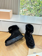 Black Louis Vuitton unisex ankle boots with monogram panel and rubber tread sole