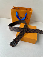 Louis Vuitton belt with checkered strap and silver-toned V buckle, extended
