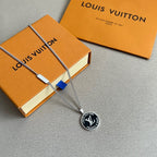 Louis Vuitton pendant necklace with silver chain and round LV Trunks & Bags charm