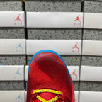 Red heel area with yellow lace eyelets and blue interior lining.