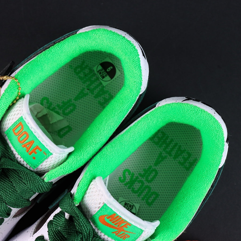 Air Force 1 sneakers, green-lined insole with DOAF label and NIKE AIR logo.