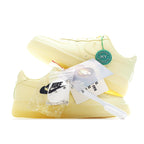 Air Force 1 low-top sneaker with pale yellow leather and green HY tag on the side