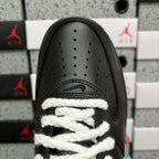 Black sneaker toe box with perforations and white lace detailing