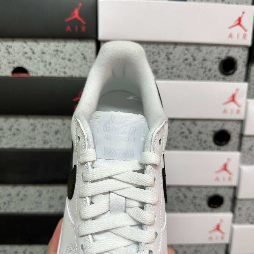 White sneaker heel with lace-up collar, Air-branded lining, back view