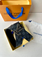 Damier-pattern leather belt with silver-toned LV buckle and studded edges