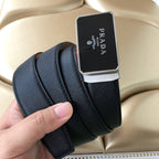 Leather belt with dark strap and silver-trimmed black Prada buckle