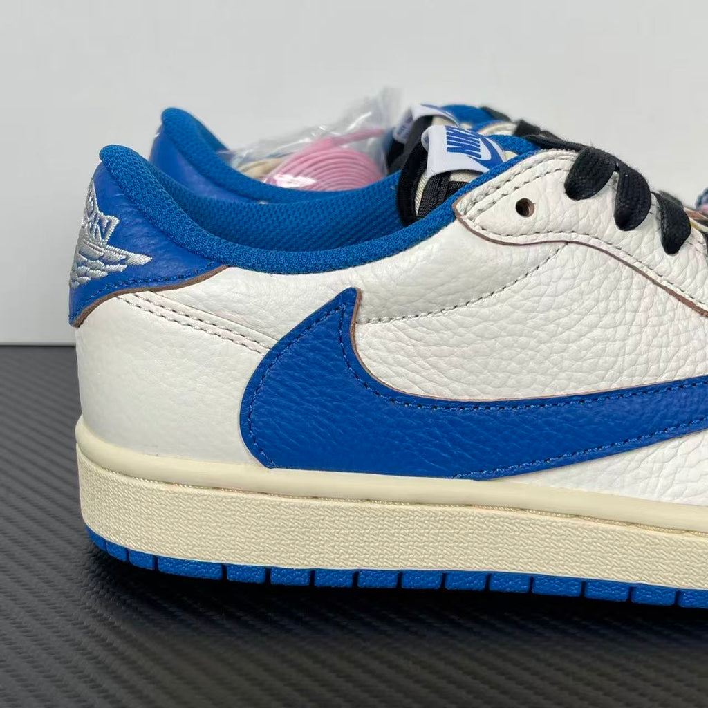White and blue low-top sneakers with black lace eyelets and padded blue collar