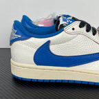 White and blue low-top sneakers with black lace eyelets and padded blue collar