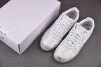 White low-top sneakers with white laces, with matching shoebox