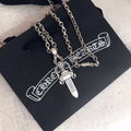 Chrome accessories necklace with silver chain and dagger pendant, on black pouch