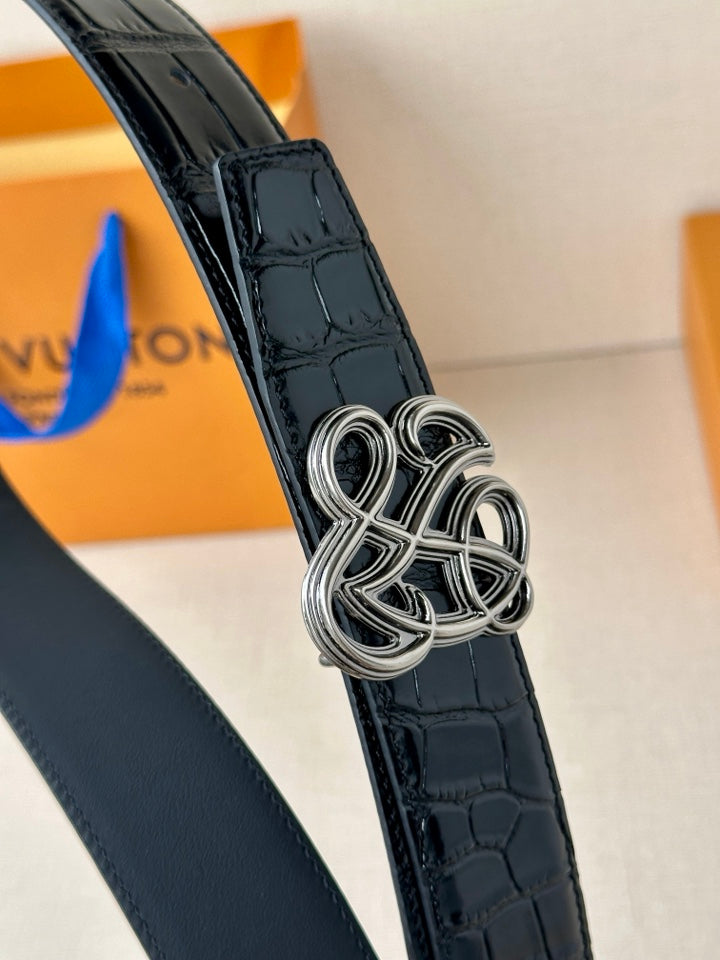 Dark navy croc-embossed belt with silver interlaced buckle, close-up
