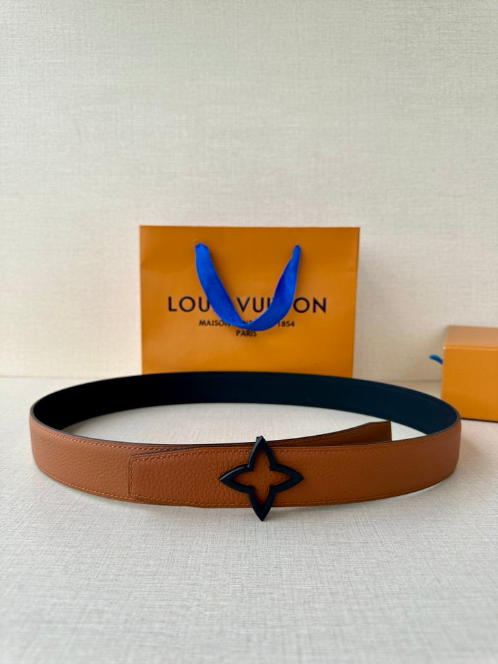 Louis Vuitton belt in tan leather with dark navy star buckle detail
