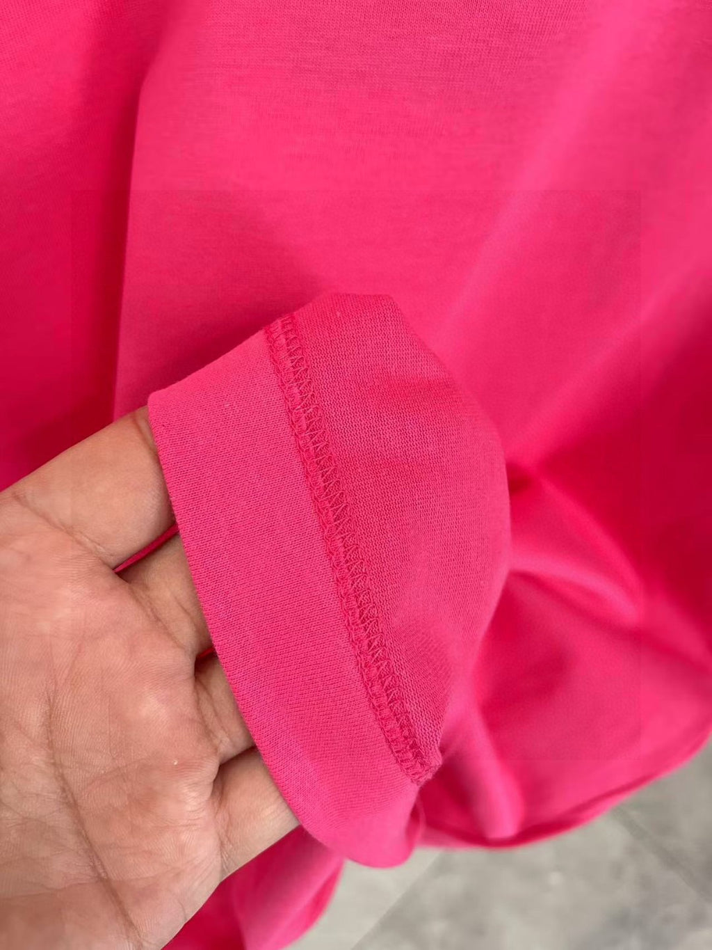 Louis Vuitton pink T-shirt fabric and sleeve cuff close-up