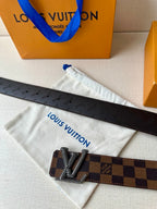Louis Vuitton belt with dust bag: dark checkered strap and silver V buckle