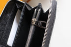 Dark textured leather wallet interior with card slots and zipper compartment