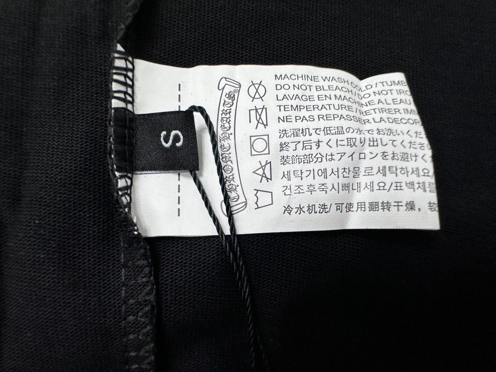 Black T-shirt neck label and care tag on inner collar