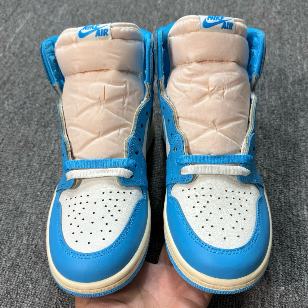 Air Jordan 1 Retro High OG sneakers, back view with Nike Air on beige collar