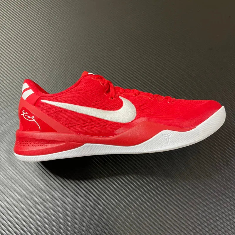 Red basketball shoes with white swoosh, side profile and low-cut collar