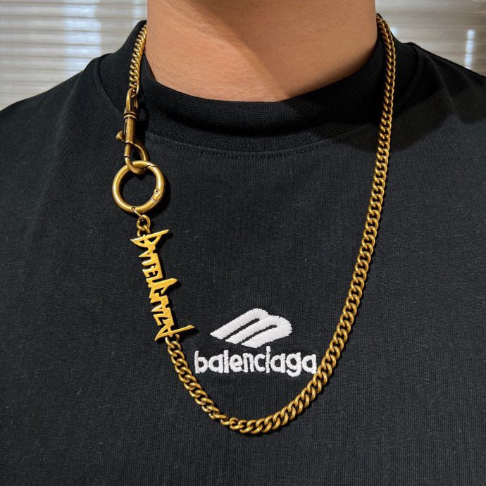 Balenciaga gold logo necklace with ring clasp and layered curb chain