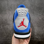 Air Jordan 4 sneakers heel view in blue suede with gray panel, red Jumpman logo, white sole