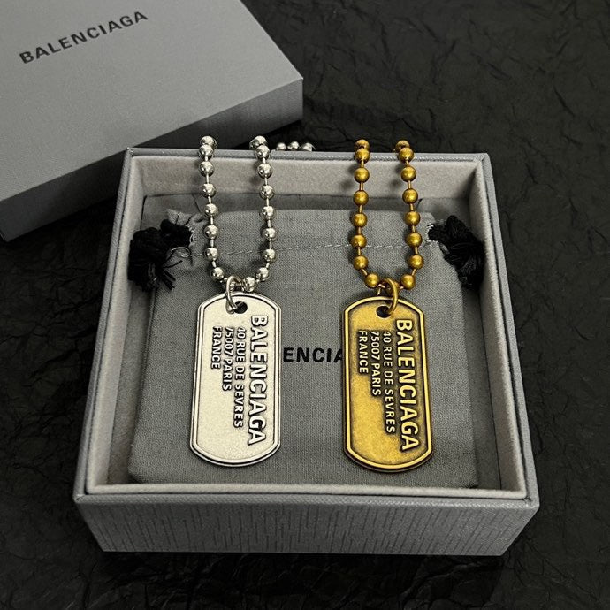 Silver-tone bead necklace with engraved dog tag pendant in a gift box
