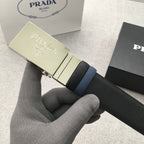 Dark belt with gold-tone Prada buckle and navy edge strip